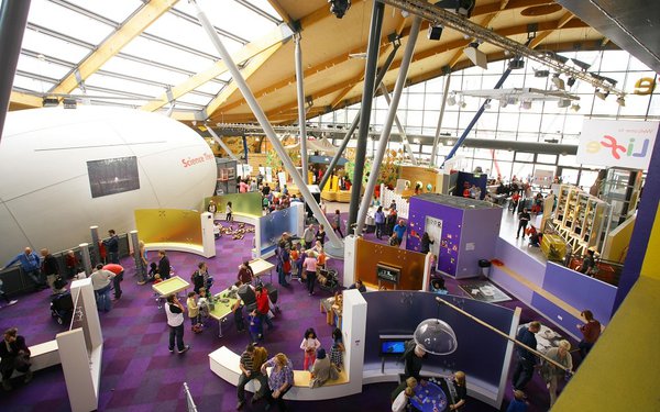 The interior of the Life Science Centre showing visitors and the science theatre attraction